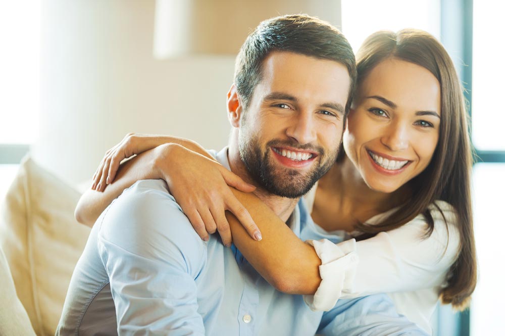 Laguna Shores Recovery Sober Dating Close up photo of Beautiful young loving couple sitting together on the couch
