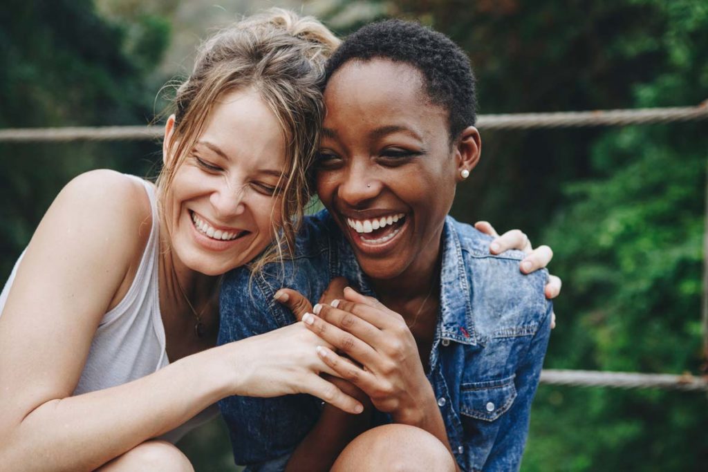 lagunashoresrecovery what is a sober companion photo of Happy friends holding each other