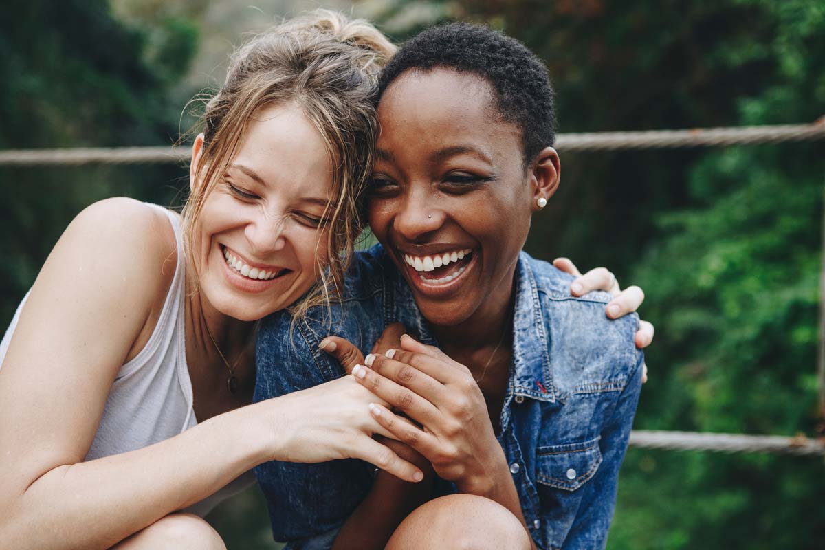 lagunashoresrecovery what is a sober companion photo of Happy friends holding each other