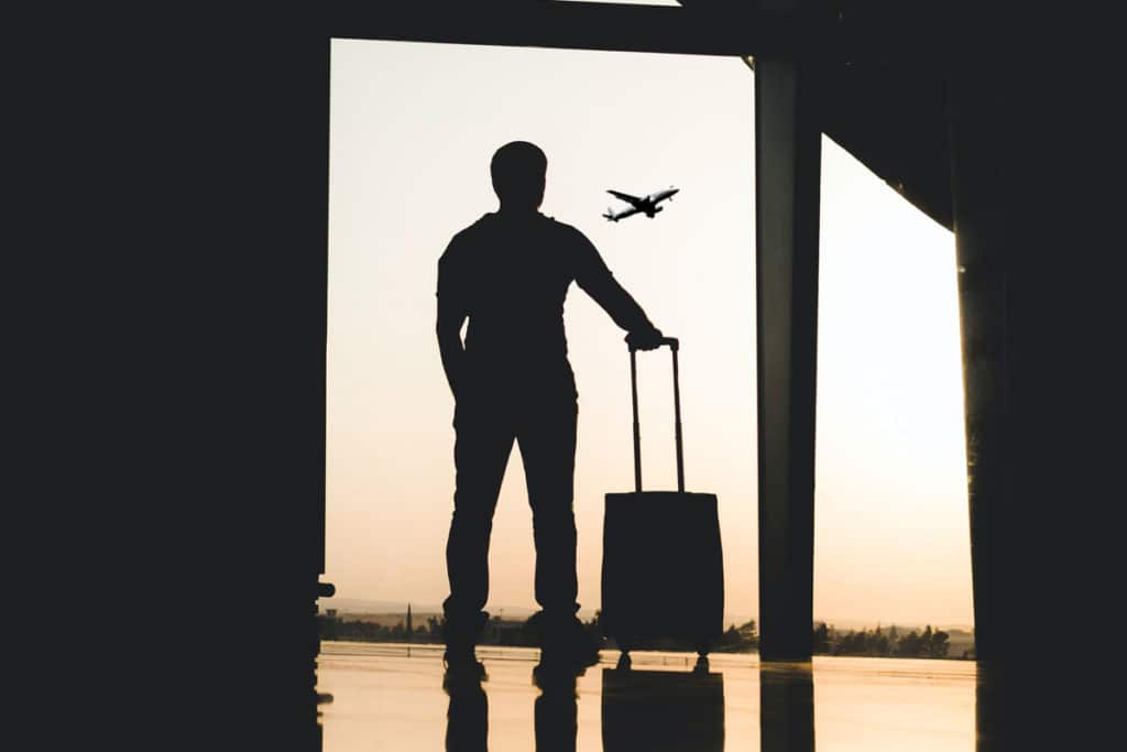 laguna shores Why Going Out of State for Addiction Treatment is a Good Thing photo of a man with a travel bag standing inside the airport