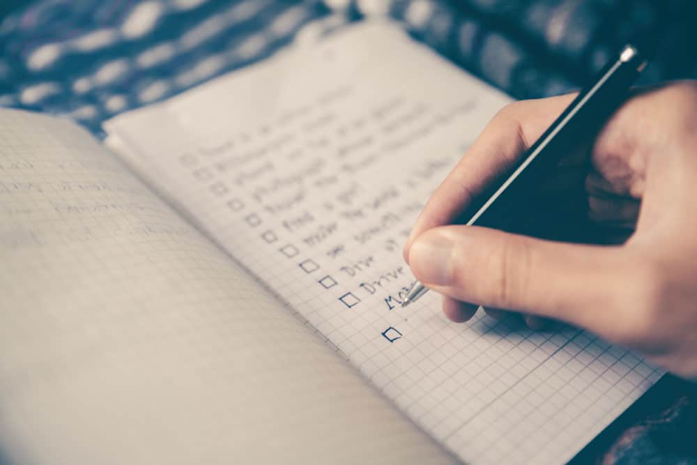 lagunashoresrecovery 7 Sneaky Ways to Avoid Drinking in Social Situations photo of a person writing his plans