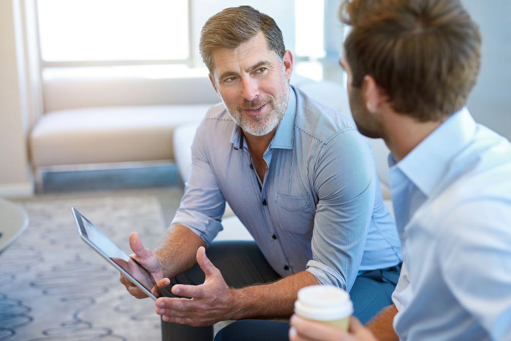 lagunashoresrecovery How to Get Insurance to Pay for Drug Rehab photo of two men discussing about getting insurance