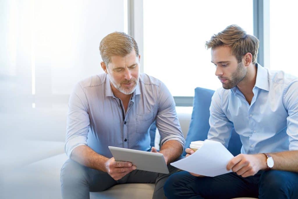 lagunashoresrecovery How to Get Insurance to Pay for Drug Rehab photo of two men discussing about getting insurance