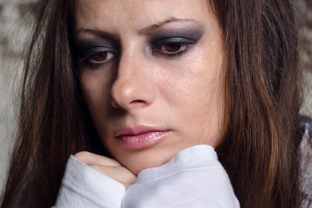Depressed young girl questioning how can she move on when an addict leaves you