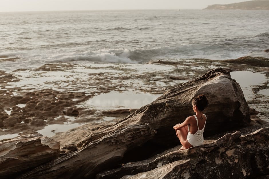 girl sitting on the seashore