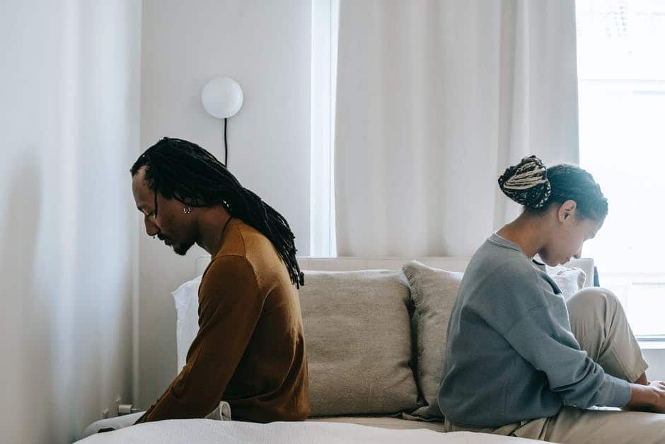 a couple sitting on the bed